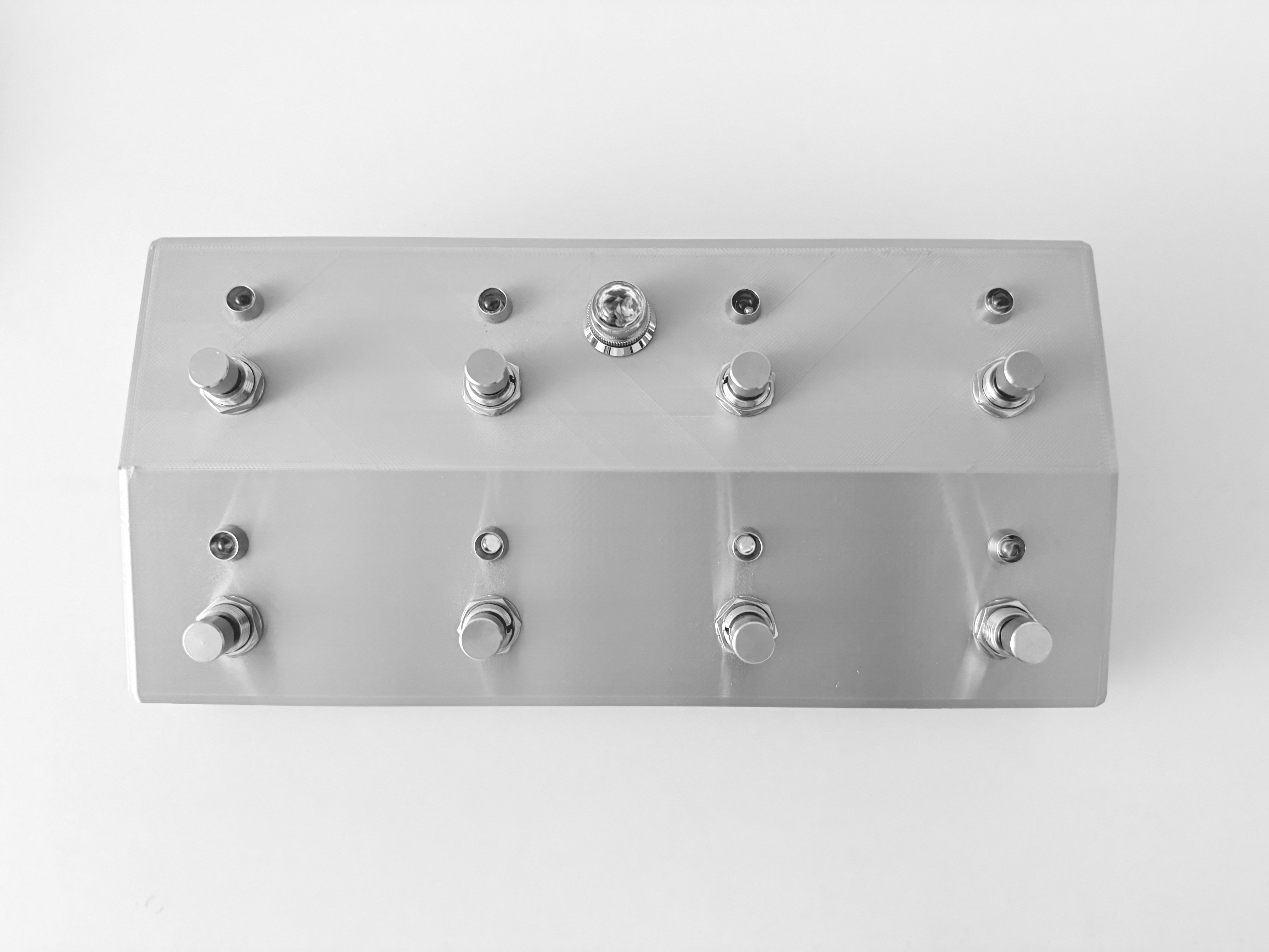 Eight-button MIDI footswitch in a silver metal-textured enclosure