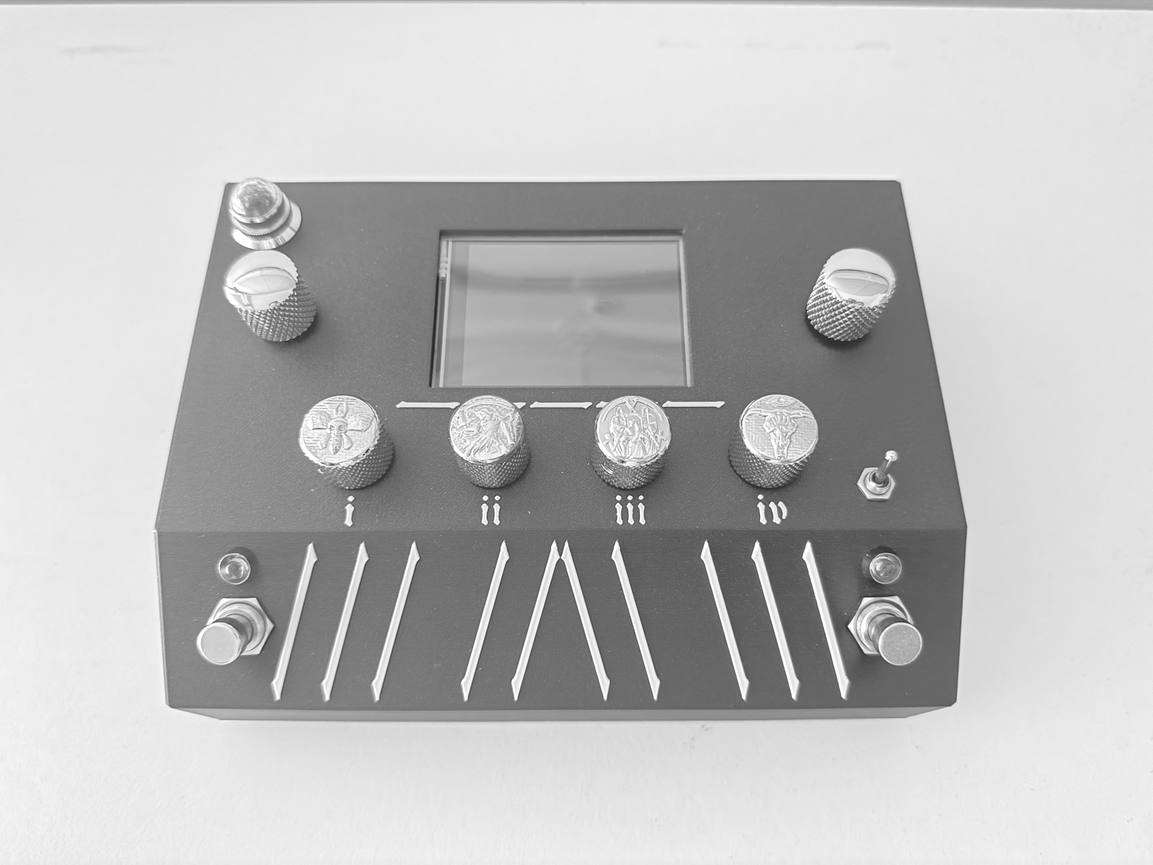 BonesFX digital guitar processor showing its touchscreen, four knobs, and two footswitches