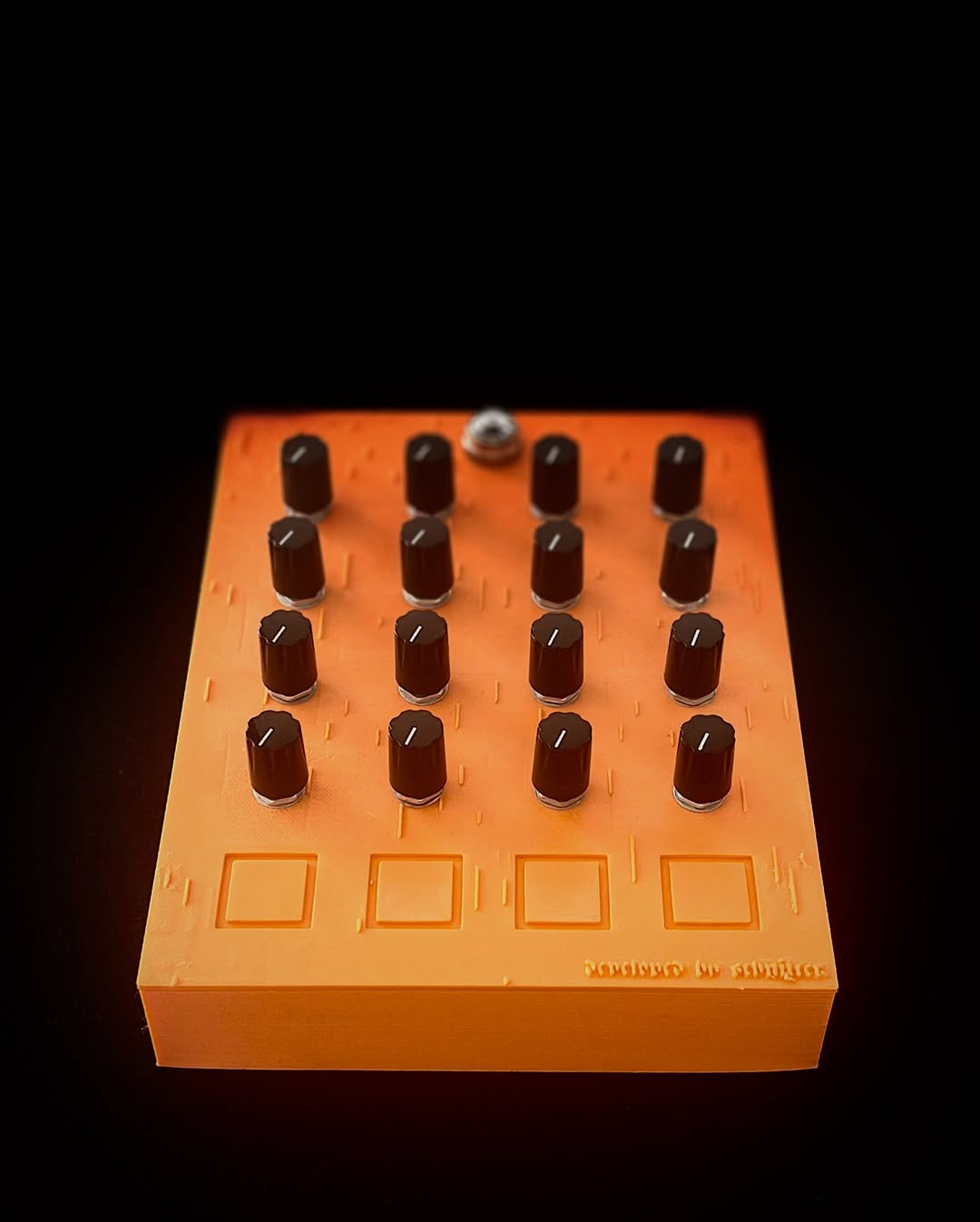 Orange GrimReach MIDI controller viewed from above